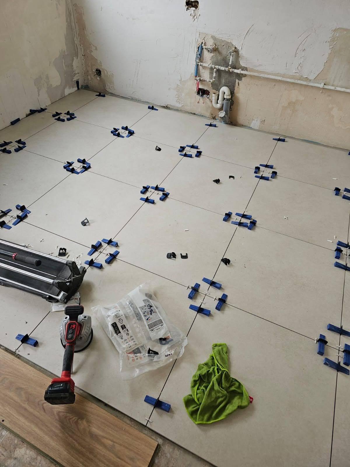 Complete bathroom renovation from scratch - plumbing connections, floor & wall tiling, full fixture installation: shower cabin, toilet and concealed cistern