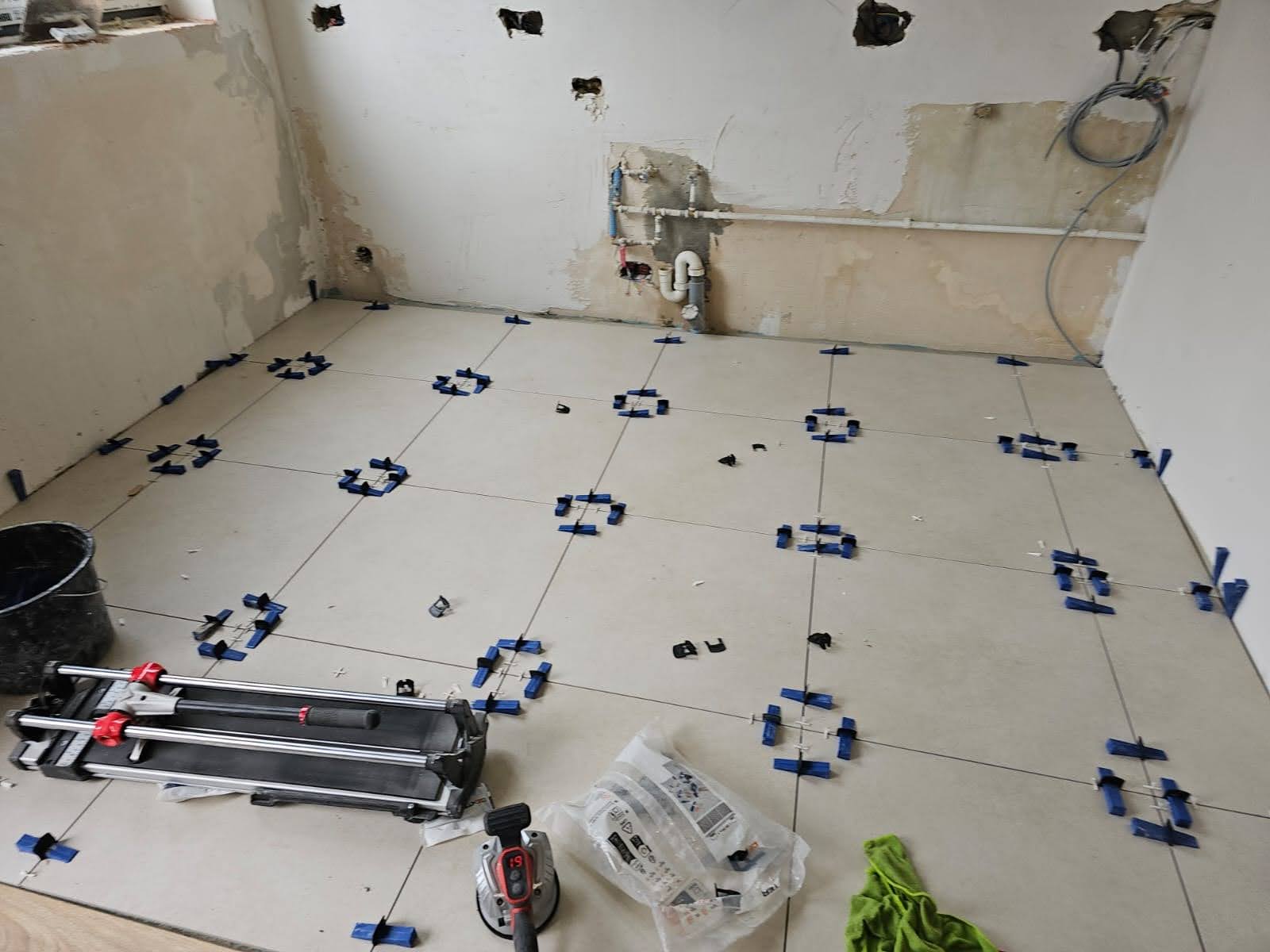 Complete bathroom renovation from scratch - plumbing connections, floor & wall tiling, full fixture installation: shower cabin, toilet and concealed cistern